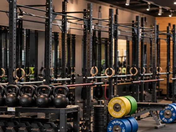 Squat racks, barbells and kettlebells on the gym floor at Uplift Gym, Richmond